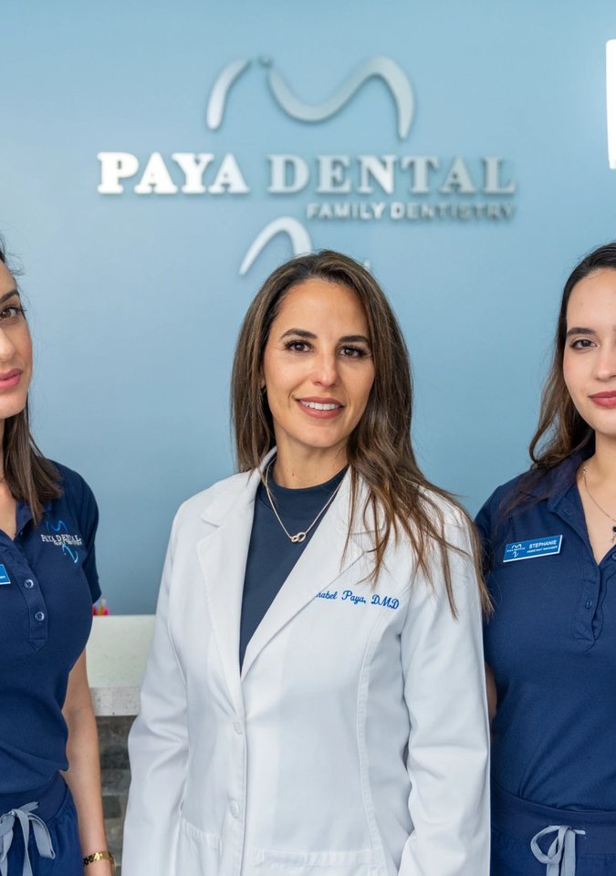 Paya Dental doctors at the front desk