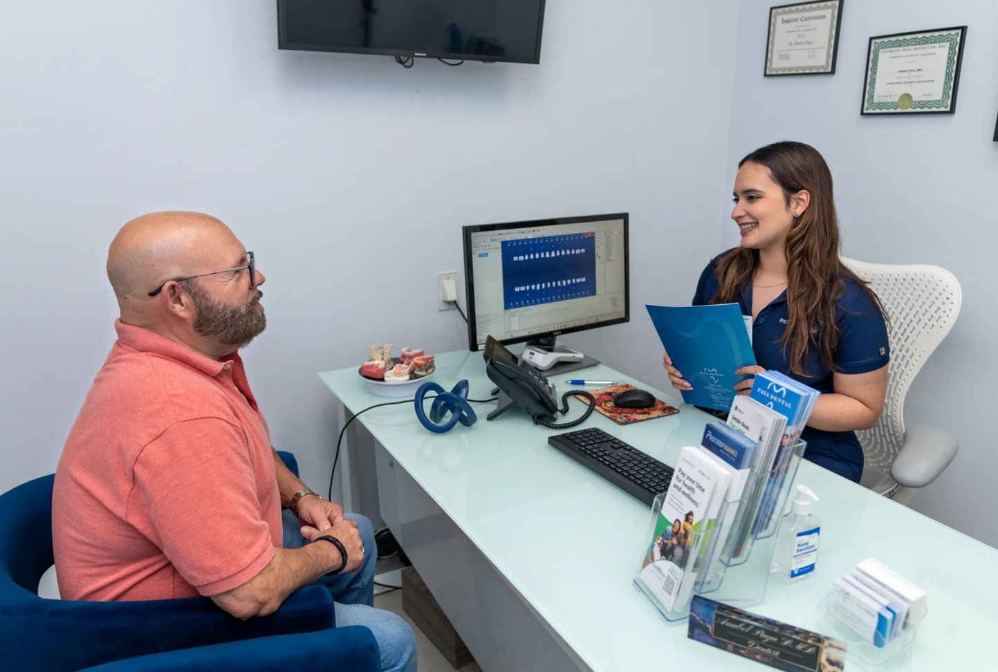 Paya Dental team member assisting a patient