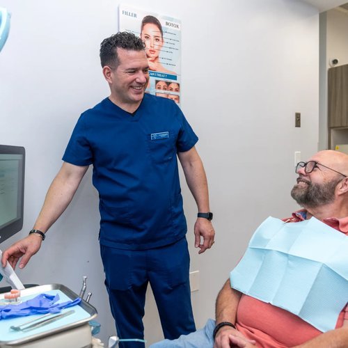 Dentist talking with a patient before treatment