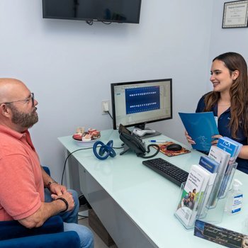 Patient reviewing payment options at the Paya Dental front desk