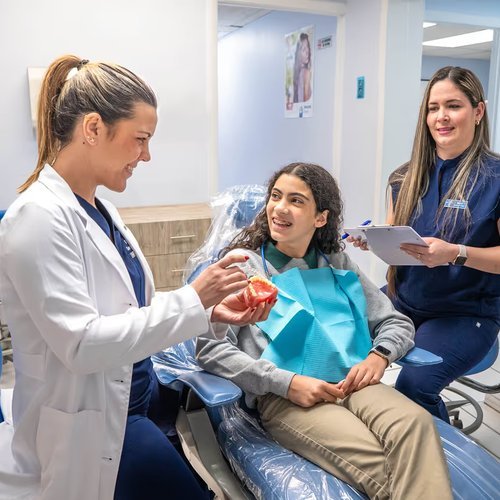 Dental team reviewing treatment with a patient
