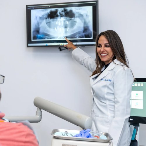 Dr. Paya reviewing an X-ray with a patient